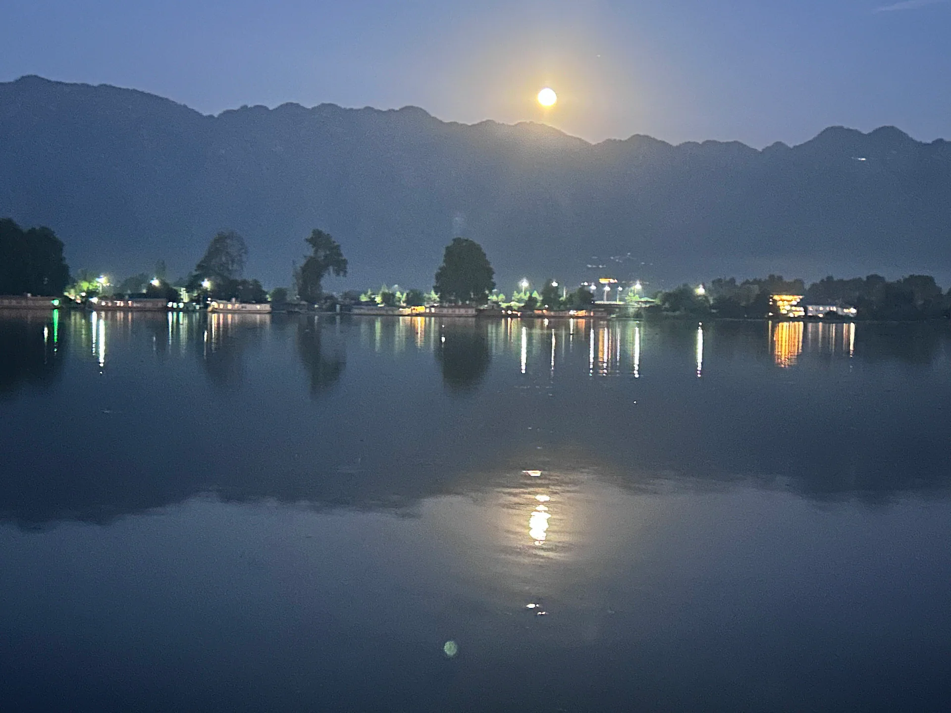 Full moon over houseboats on Nigeen Lake