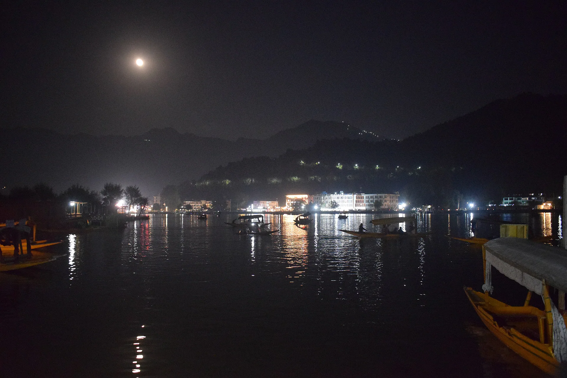 Dal Lake under moonlight with the lights of the shore